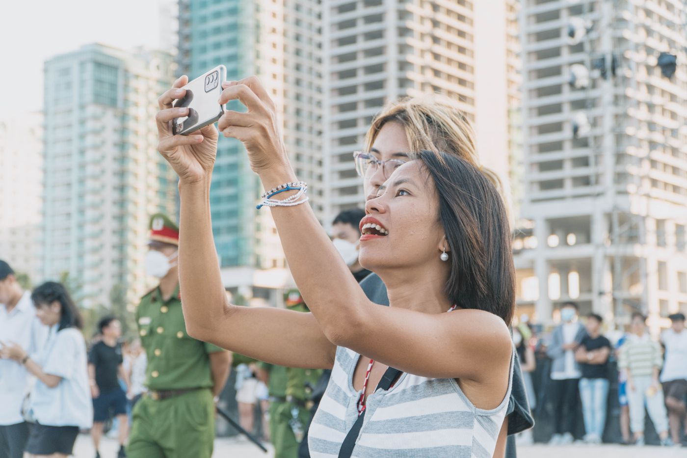 A visitor using a phone at an outdoor event