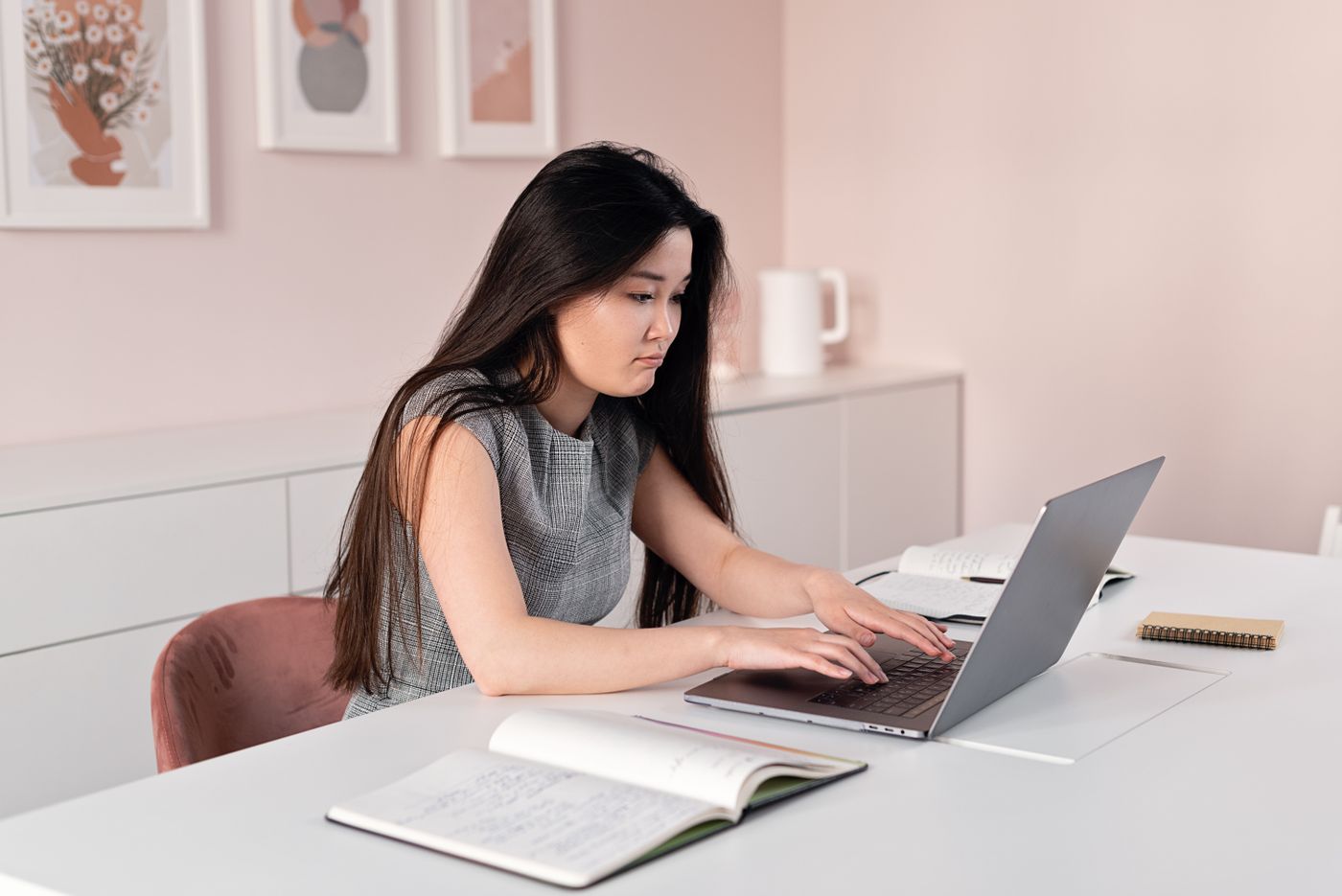 A person filling in a form on a laptop