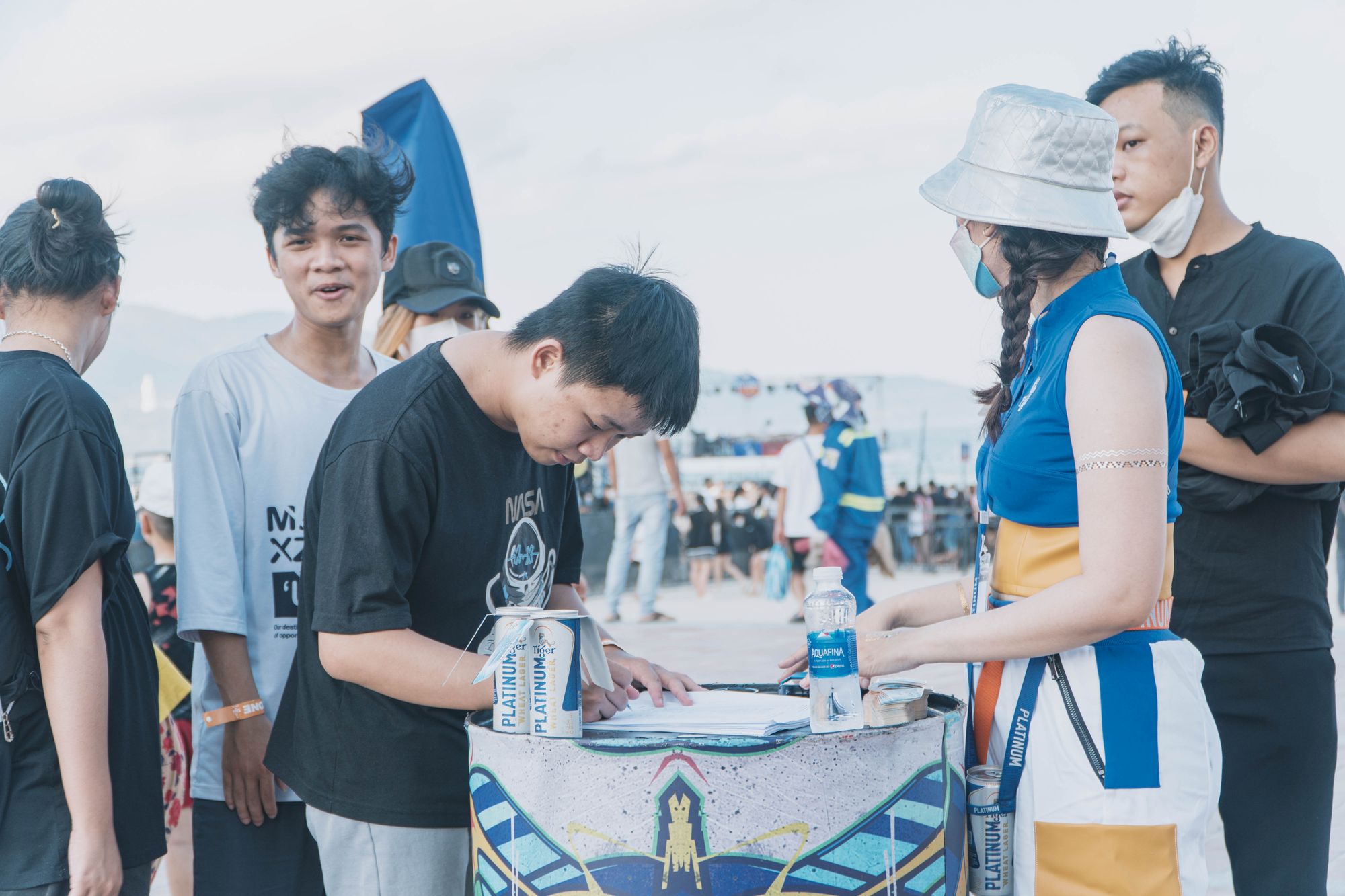 Visitors registering at a table at an outdoor event